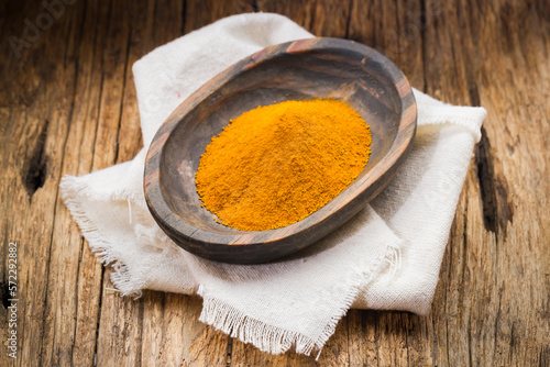 turmeric powder in container, food with high nutritional value