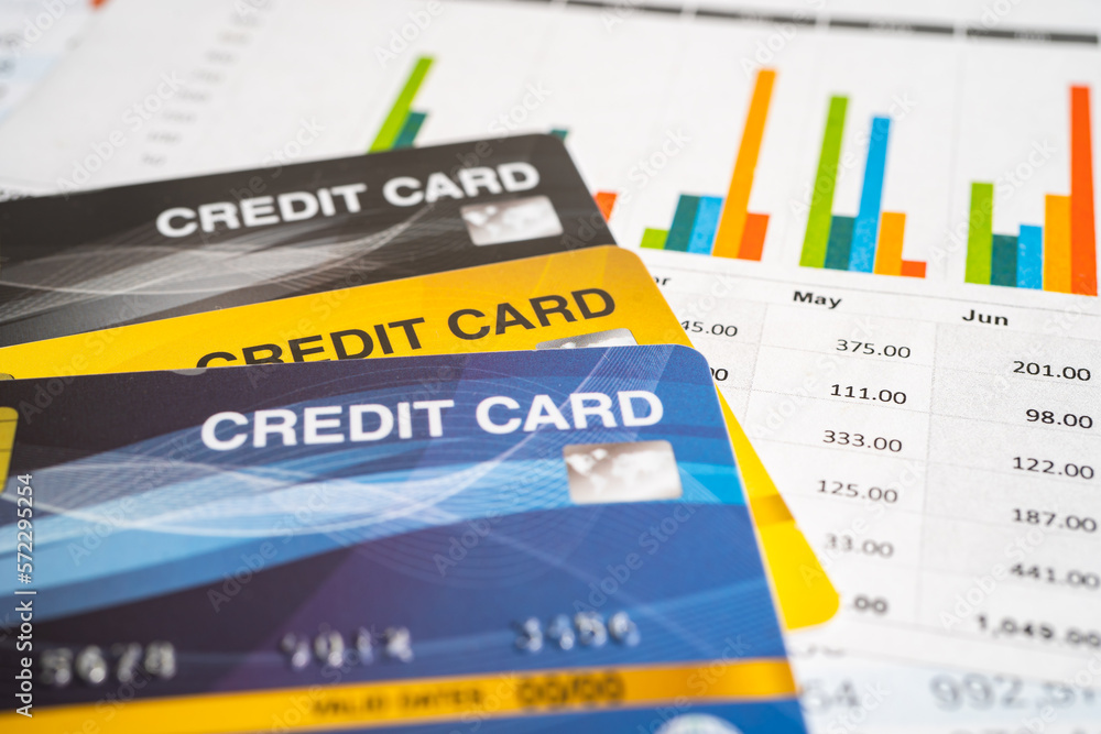 Obraz premium Credit card model on chart and graph spreadsheet paper. Finance development, Banking Account, Statistics, Investment Analytic research data economy, Stock exchange trading, Business company concept.