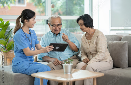 Group of asian senior people listening to young nurse. Psychological support group for elderly and lonely people in a community centre. Group therapy in session sitting in a circle in a nursing home.