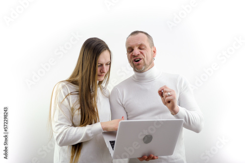 Slika na platnu man grimaced screams telling woman how to use laptop with new accounting program
