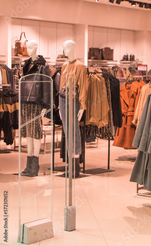 interior of fashion boutiques with modern clothing and mannequins