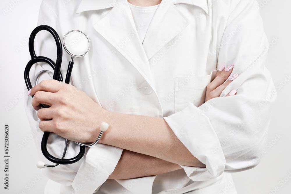 Doctor holding a phonendoscope or stethoscope in his hand Doctor holding a phonendoscope or stethoscope in his hand