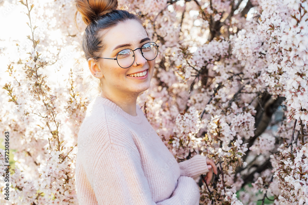 Portrait of young smiling caucasian hipster girl in glasses with pimples, acne on her face. Body positivity and diversity. Teenage skincare problems. Generation Z girl enjoy spring mood. Portrait of young smiling caucasian hipster girl in glasses with pimples, acne on her face. Body positivity and diversity. Teenage skincare problems. Generation Z girl enjoy spring mood.