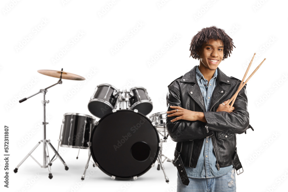 Fototapeta premium African american male drummer standing in front of a drum kit