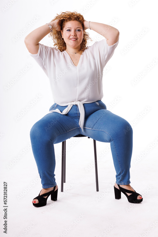 Plus size fashion model, fat woman in denim clothes and white shirt on white background, overweight female body