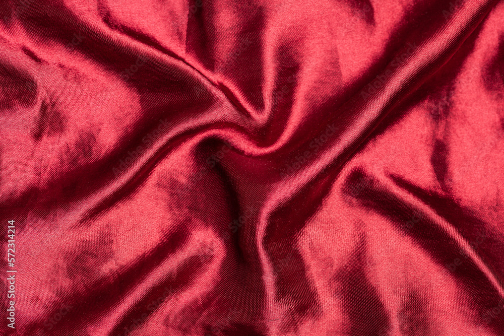 Smooth elegant burgundy silk or satin luxury fabric texture. Top view Smooth elegant burgundy silk or satin luxury fabric texture. Top view