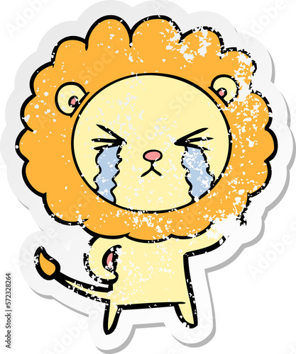 distressed sticker of a cartoon crying lion