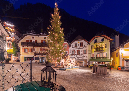 Hallstatt. Old town square with a Christmas tree on Christmas night.