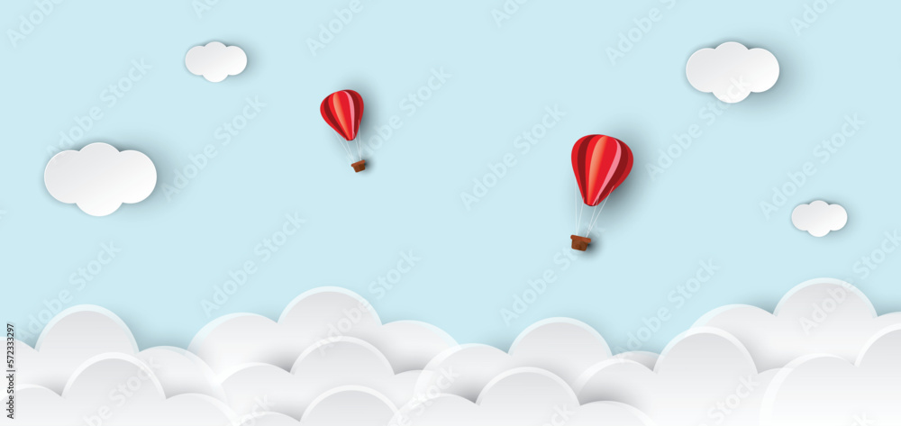 Hot air balloons and clouds on abstract blue sky background. Hot air balloons rise in the sky. paper cut and craft design. vector illustration.