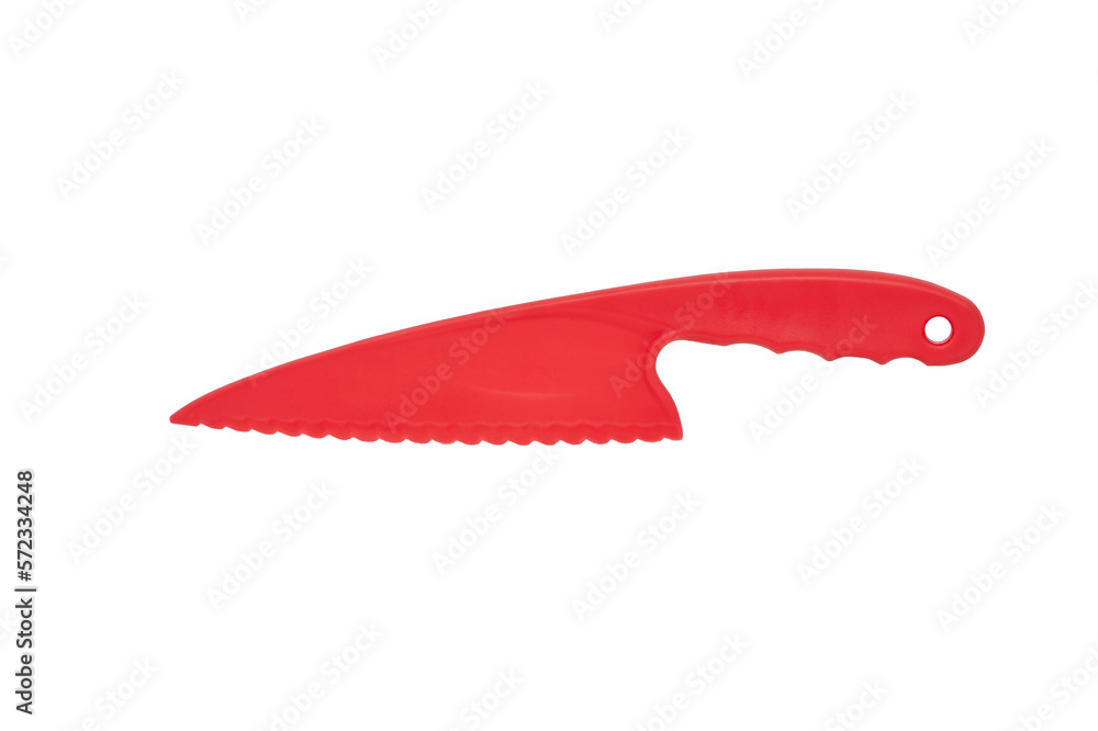 plastic knife of red color for cutting a cake on a white background