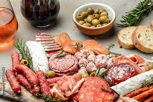 Antipasto sliced meat, ham, salami, olives and wine. Restaurant menu, dieting, cookbook recipe top view