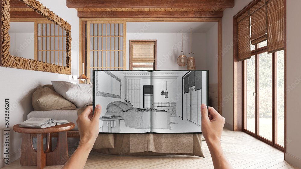 Hands holding notepad with japandi bedroom design blueprint sketch or ...