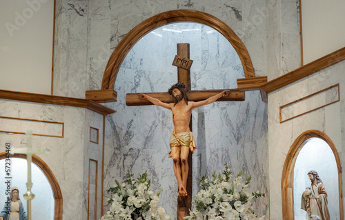 Leinwand Poster statue of jesus christ crucified in altar of catholic church