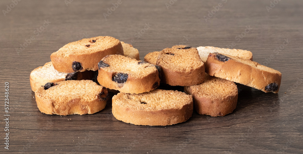 Crouton with raisins lie on a wooden table Crouton with raisins lie on a wooden table