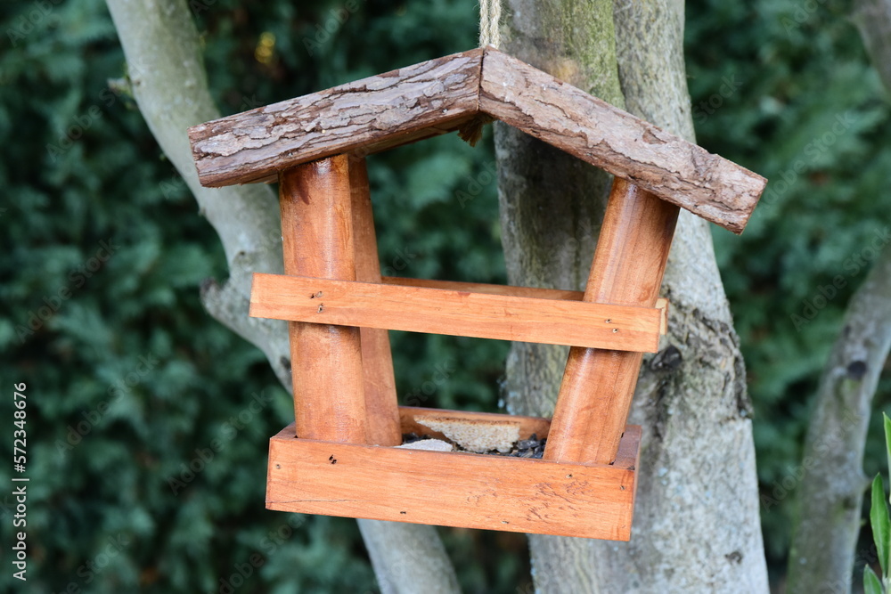 Small wooden house for feeding birds in winter Small wooden house for feeding birds in winter