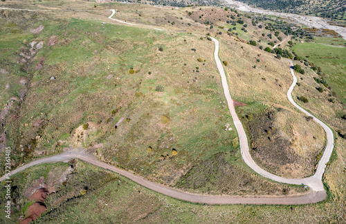 Twisty dangerous rural road in the mountains. Adventure outdoors.