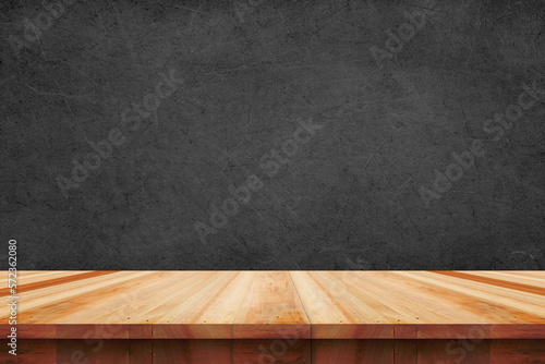 Wood table top on bare concrete wall background - can be used for display or montage your products