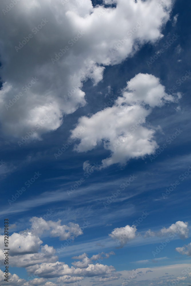 Blue sky with clouds. Spring or summer background.
White clouds on the blue sky have a complex pattern.
Blue sky with clouds. Spring or summer background.
White clouds on the blue sky have a complex pattern.