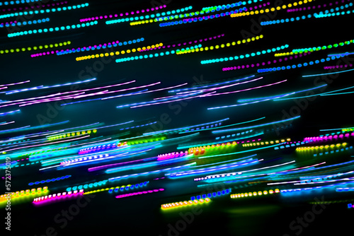 Blurred abstract background. Drawing with light, garlands.