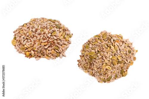 Mix of seeds for a salad. A pile of mixed seeds isolated on white background.