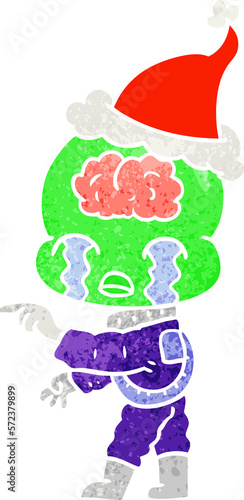 retro cartoon of a big brain alien crying and pointing wearing santa hat