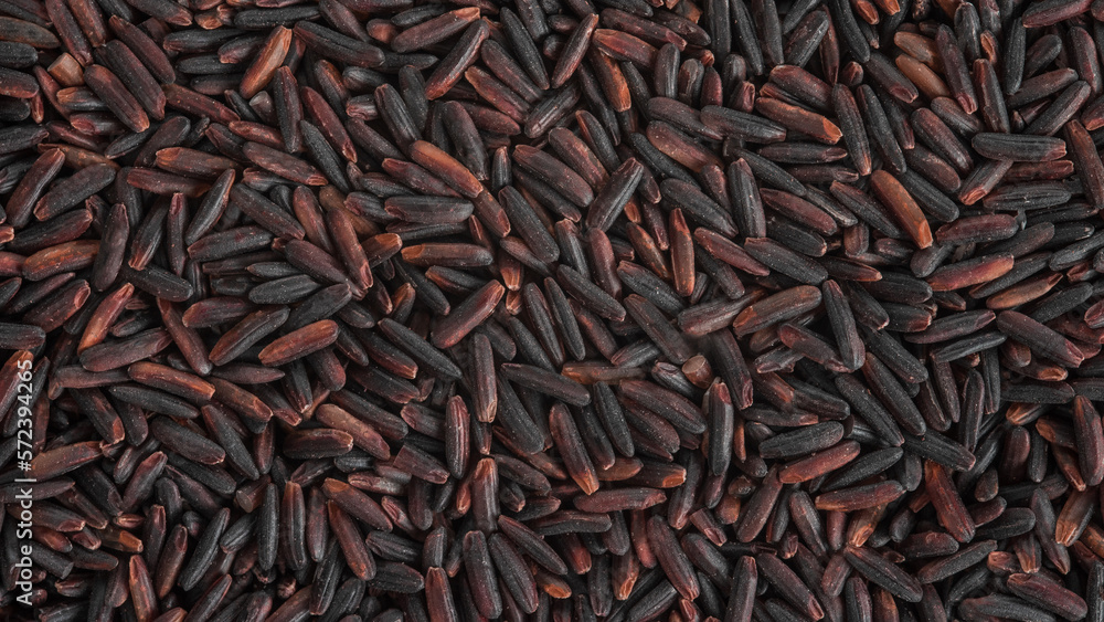 The texture of the surface of the grains of black rice.