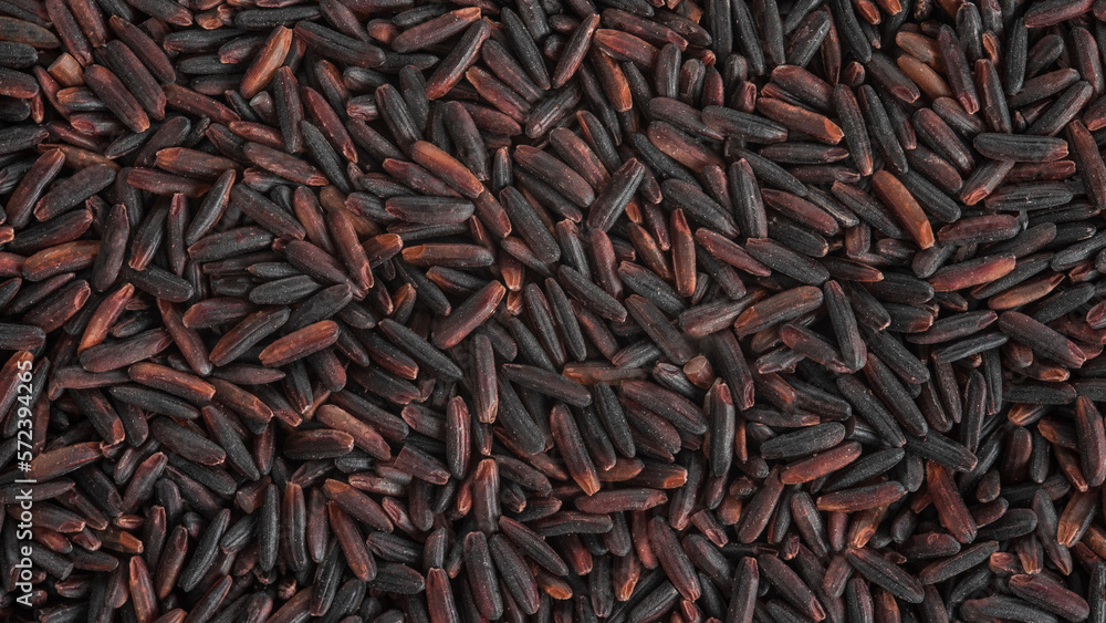 The texture of the surface of the grains of black rice. The texture of the surface of the grains of black rice.