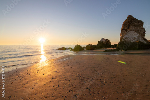 One of the most beautiful beaches in Spain, called (Torre Del Loro, Huelva) in Spain.  Surrounded by dunes, vegetation and cliffs.  A gorgeous beach. photo