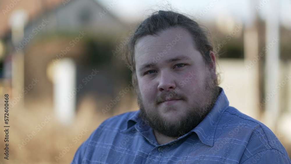 Portrait of a young chubby man close up face smiling at camera in tracking shot in movement. Happy male caucasian person in 20s Portrait of a young chubby man close up face smiling at camera in tracking shot in movement. Happy male caucasian person in 20s