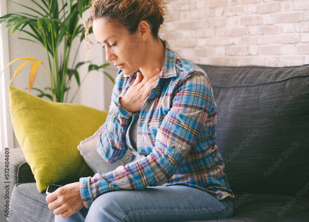 Pressure in the chest. Closeup photo of a stressed woman who is