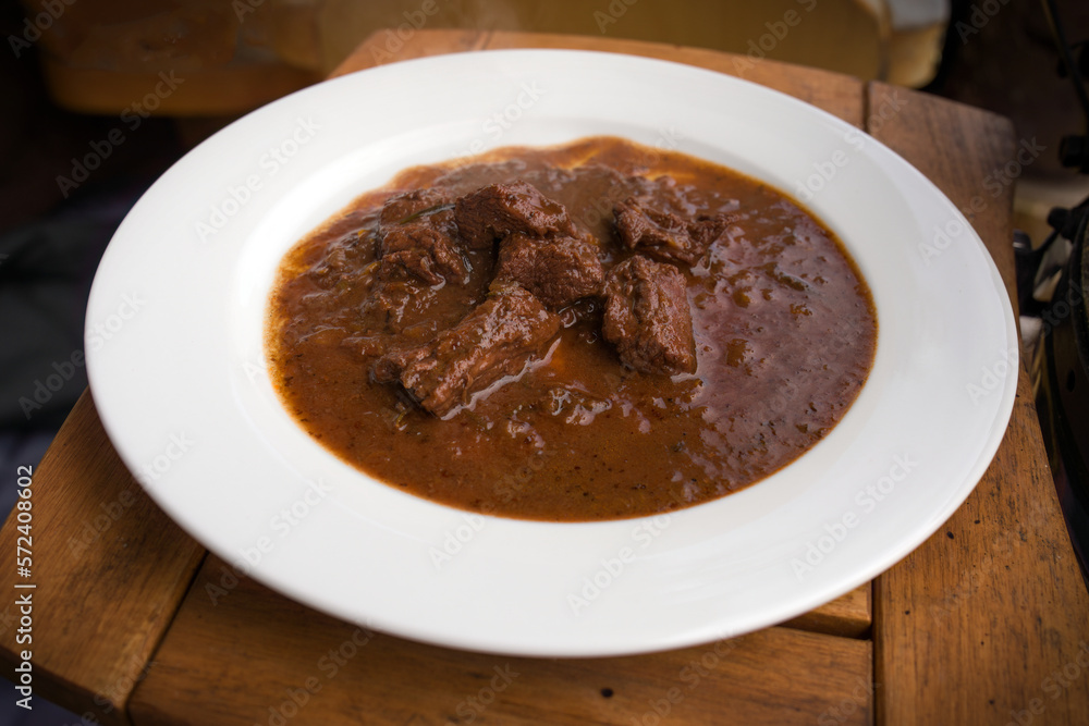 ready to eat - goulash from venison meat served on a white plate ready to eat - goulash from venison meat served on a white plate