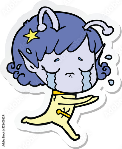 sticker of a cartoon crying alien girl