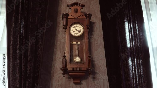 Antique wall clock with a pendulum.