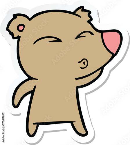 sticker of a cartoon whistling bear