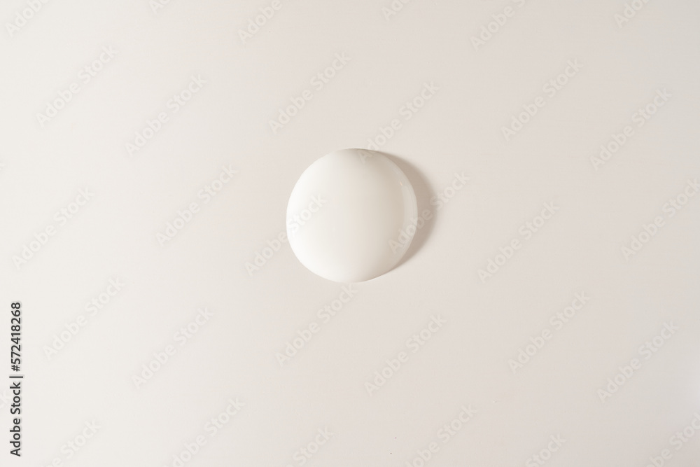 A round drop of cosmetic cream. A white creamy drop of skin care cream. A smooth drop isolated on a white background with space to copy. High quality photo A round drop of cosmetic cream. A white creamy drop of skin care cream. A smooth drop isolated on a white background with space to copy. High quality photo