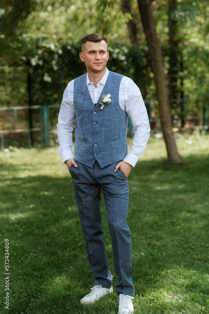 portrait of the groom in a light gray suit portrait of the groom in a light gray suit