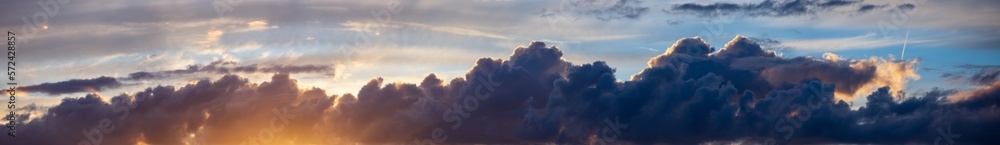 Obraz premium Sky panorama. Beautiful dramatic big clouds in the sky. Landscape of the power of heaven and nature. Copy space