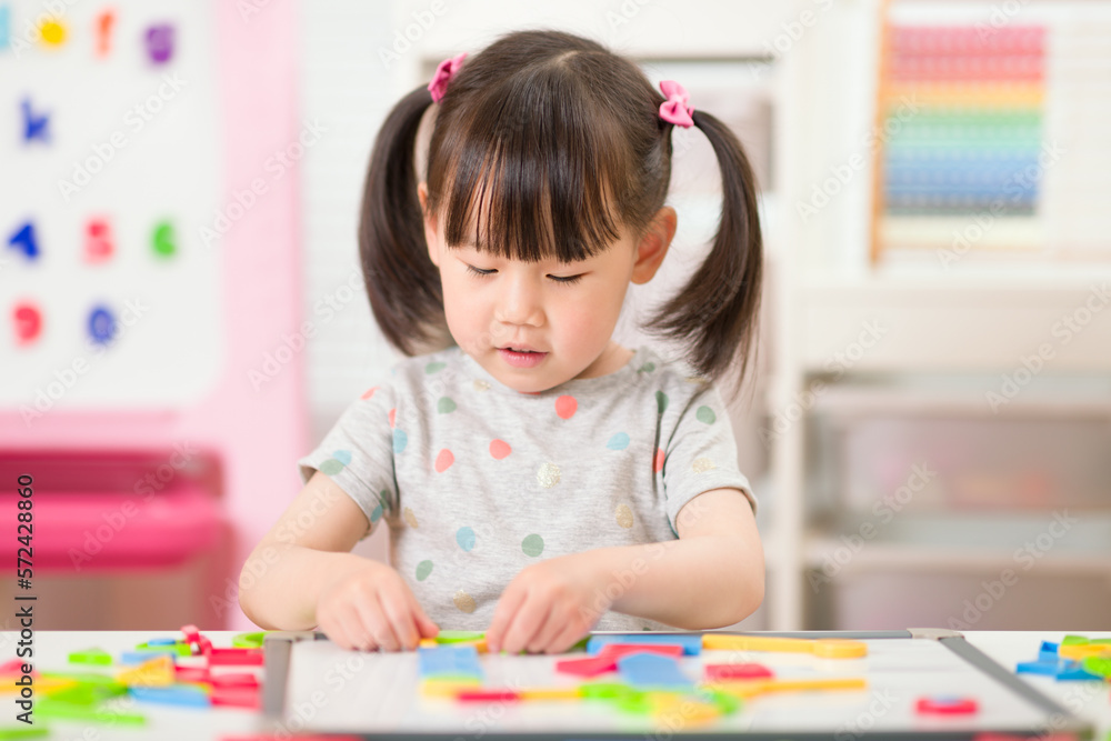 young girl playing creative toy blocks for homeschooling young girl playing creative toy blocks for homeschooling
