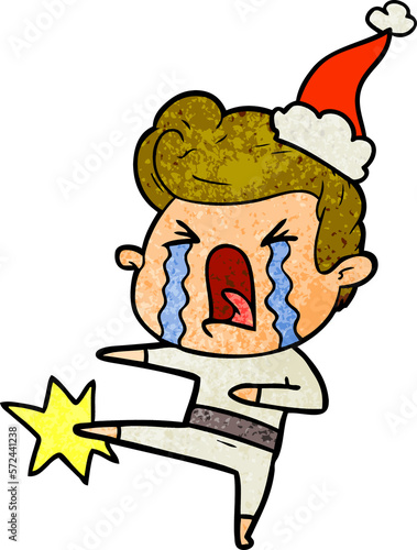 textured cartoon of a crying man wearing santa hat