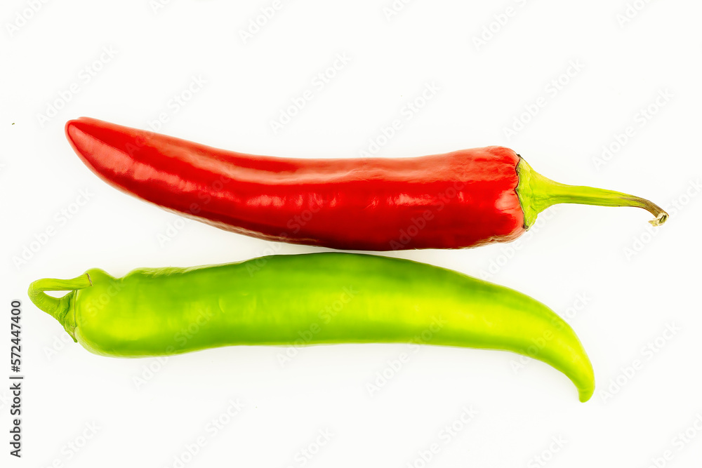 Two chili peppers, red and green, flat layout. Isolated on a white background hot peppers, peppers for lettuce. Baby food, veganism, dietary nutrition