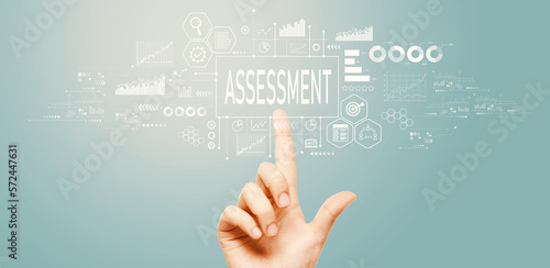 Assessment concept with hand pressing a button on a technology screen