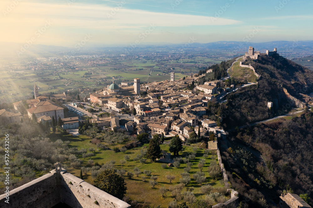 extended aerial view of the city of assisi at dawn