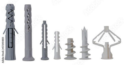 Plastic dowels of various types for fixing screws in the wall on an isolated background. Construction accessories used for repairs. photo