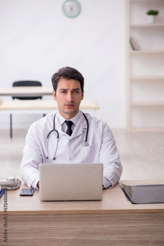 Young male doctor in telemedicine concept Young male doctor in telemedicine concept