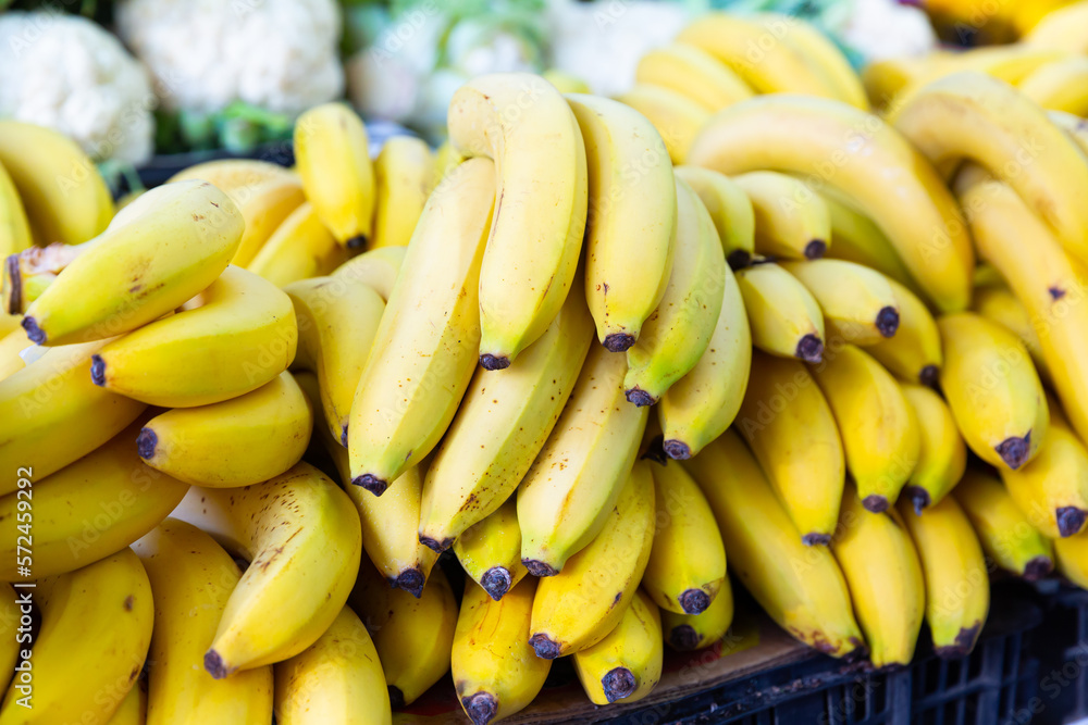 close up of mature bananas on counter in marketplace