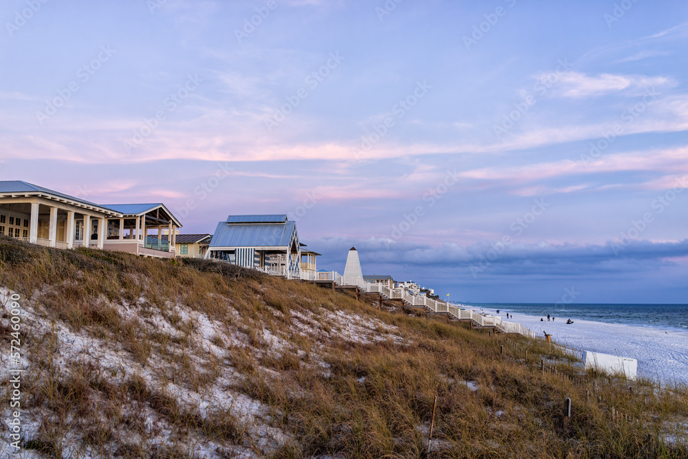 Coastline view on Santa Rosa Beach in Seaside, Florida with white sand coast in winter at Gulf of Mexico town in sunset twilight blue hour