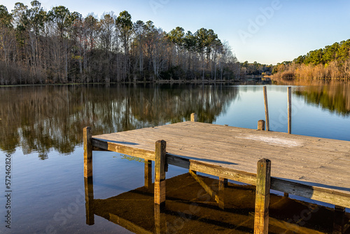 Eutawville, South Carolina sunset near Lake Marion with boat dock and water landscape view at Fountain lake in spring evening with nobody
