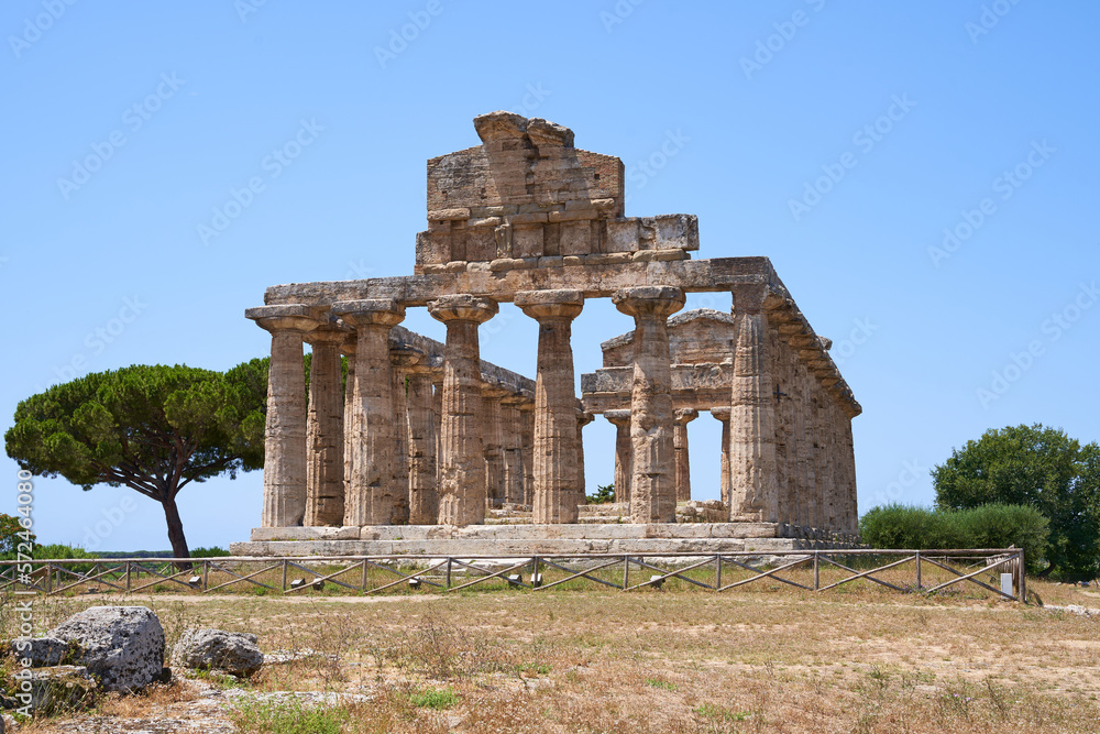 View on the Athena Temple from the Unesco World Heritage Site in Paestum. The facility is located in the Campania region of Italy. Ancient Greek culture in southern Italy.