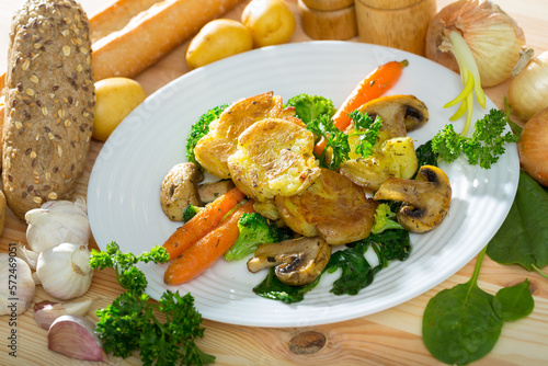 Traditional Australian Crash Hot Potatoes served with baked mushrooms, vegetables and greens