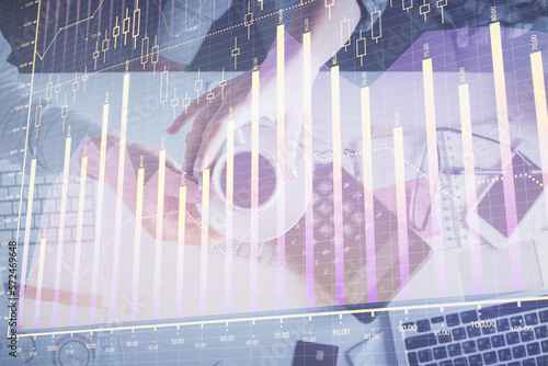 Double exposure of man and woman working together and financial chart hologram drawing. market analysis concept. Computer background. Top View.